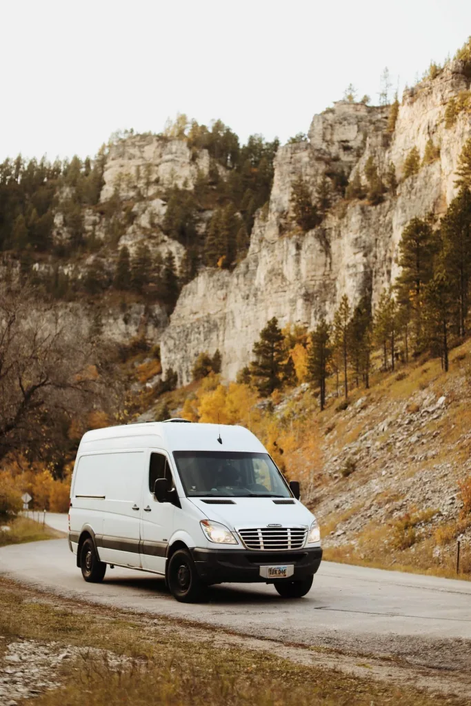 White Sprinter Van in Spearfish Canyon