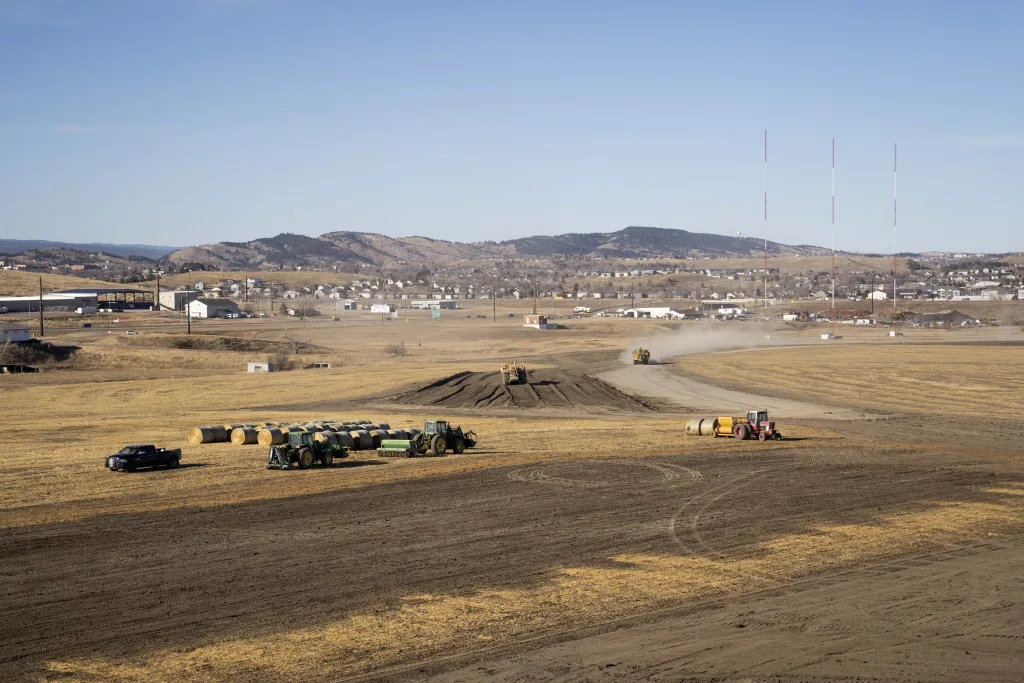 Large yellow machinery moves dirt at Black Hills Industrial Center