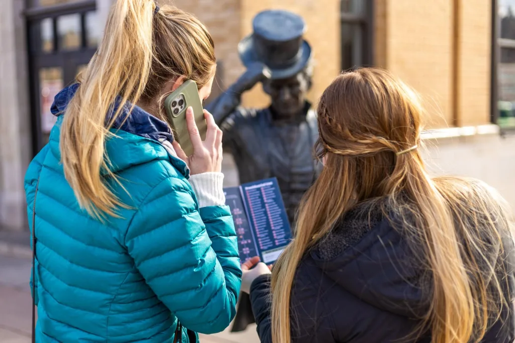 Two Women call on cell phone for city of presidents audio tour