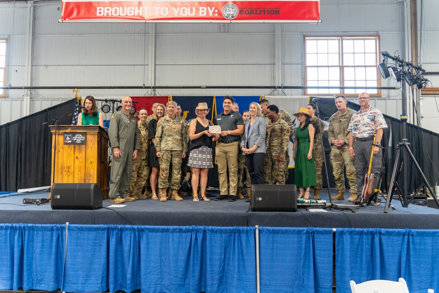 Liberty Center YMCA receives military friendly business award. Group stands on stage