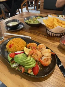 ma cualli dish features fice, avocado and shrimp