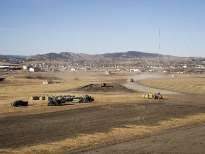 Large yellow machinery moves dirt at Black Hills Industrial Center