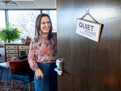 Stacey Keyser opens a door at her Rapid City Counselor office with sign that reads quiet please.