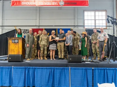 Liberty Center YMCA receives military friendly business award. Group stands on stage